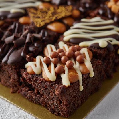 chocolate truffle cake topped with caramel and chocolate