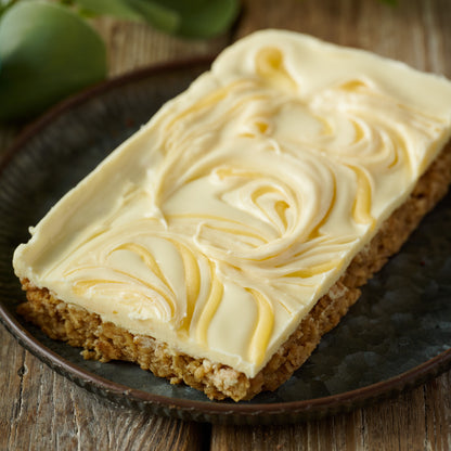 all butter flapjack topped with smooth white chocolate topping & lemon curd